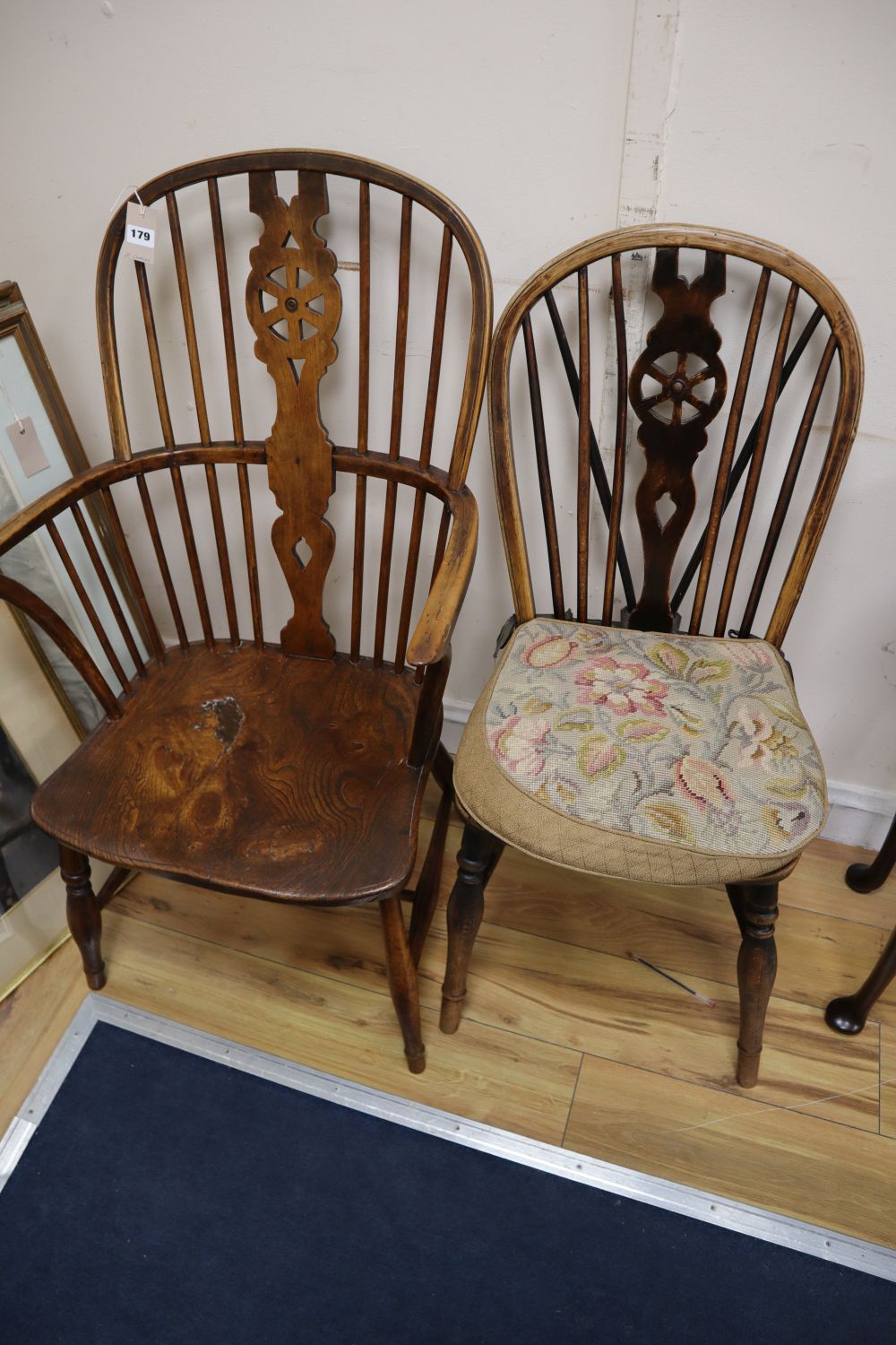 A 19th century ash, beech and elm Windsor wheelback armchair and a Windsor wheelback single chair